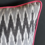 Load image into Gallery viewer, Damn The Weather! Large Rectangular Ikat Cushion with Rose Pink Piping.
