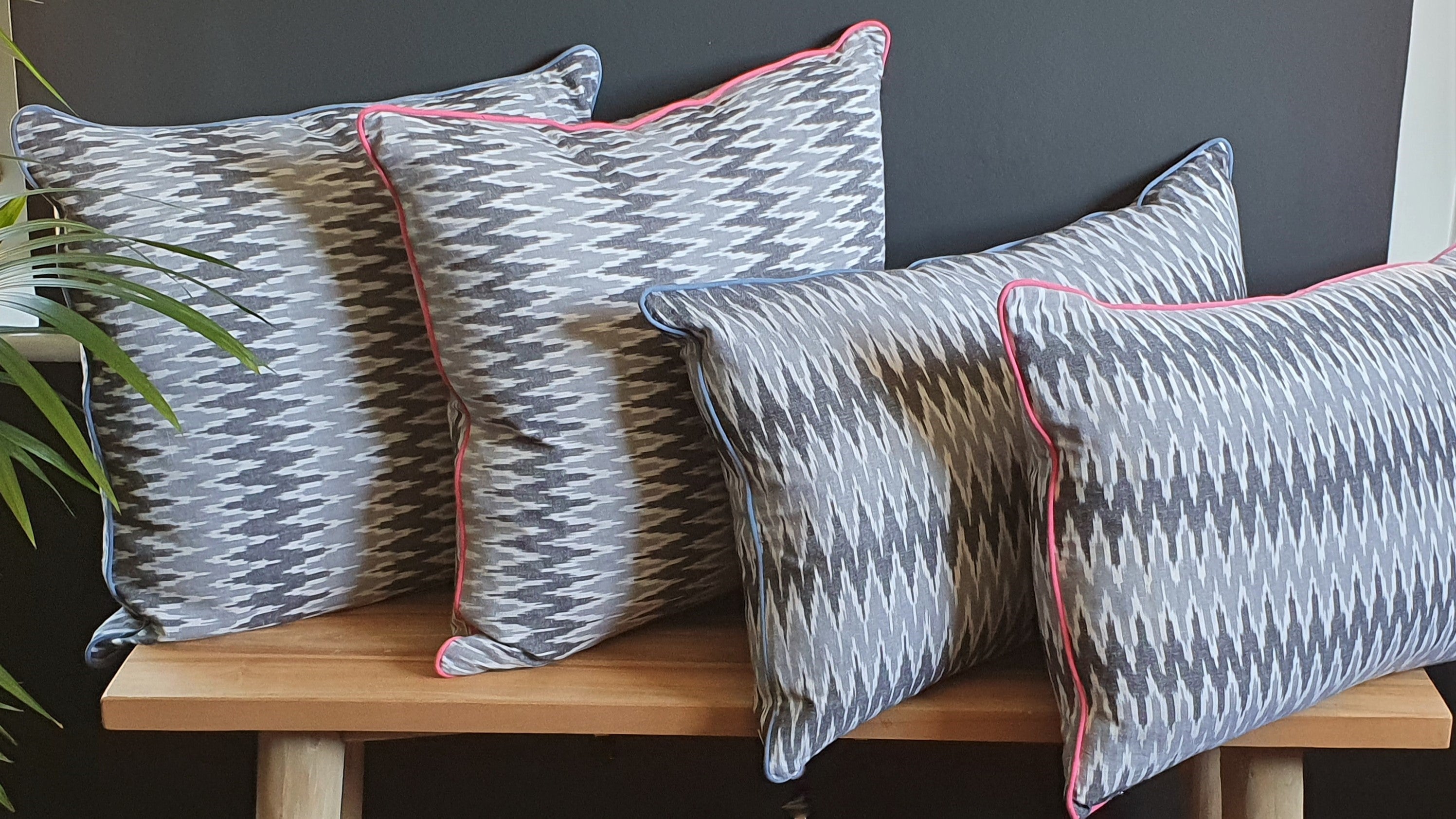 Damn The Weather! Large Square Ikat Cushion with a Stormy Blue Piping.