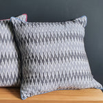 Load image into Gallery viewer, Damn The Weather! Large Square Ikat Cushion with a Stormy Blue Piping.
