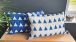 Load image into Gallery viewer, Olivia Large Rectangular Azure Triangle Ikat Cushion with Pom Poms
